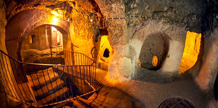 Maze of caves with stairs inside Derinkuyu Underground City, Turkey.