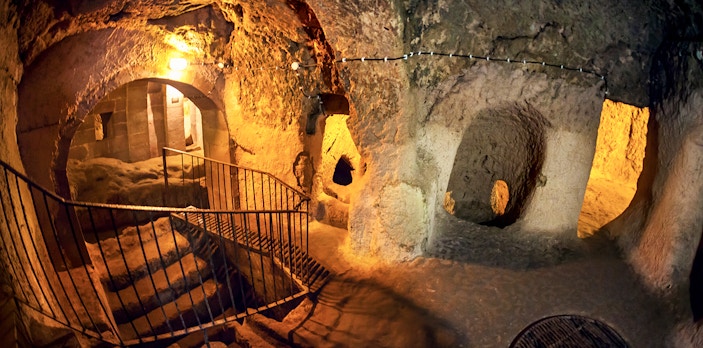 Maze of caves with stairs inside Derinkuyu Underground City, Turkey.