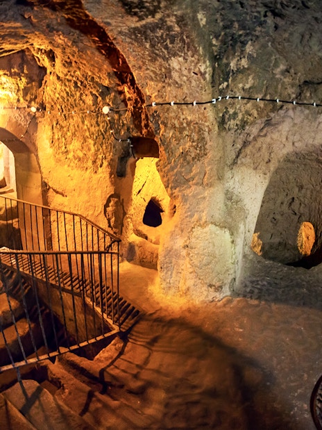 Maze of caves with stairs inside Derinkuyu Underground City, Turkey.