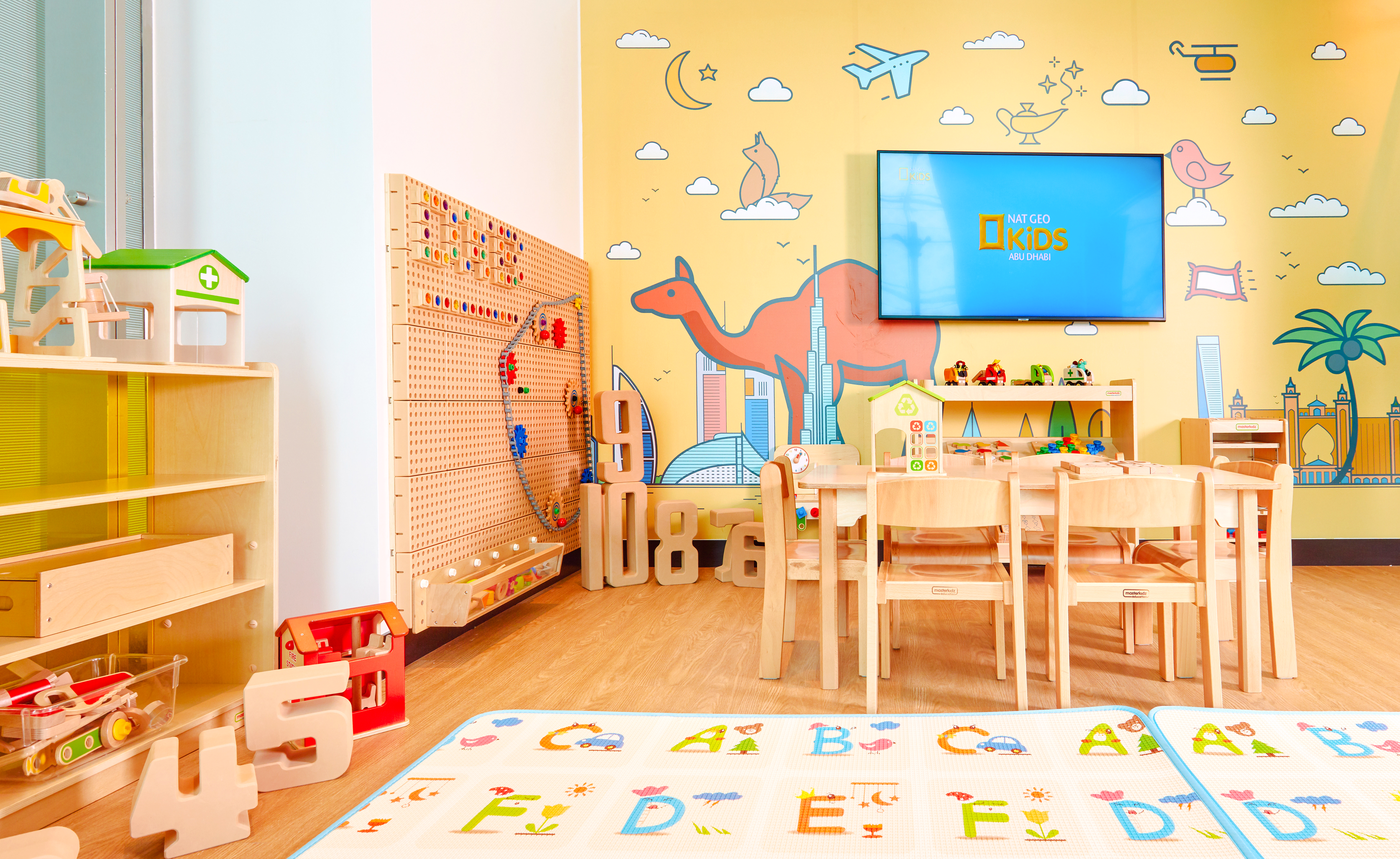 Children's play area at Plaza Premium Lounge, Dubai International Airport, with toys and colorful decor.
