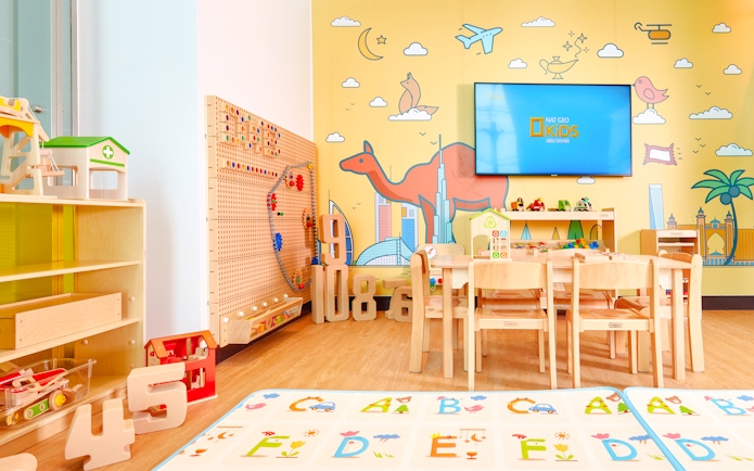 Children's play area at Plaza Premium Lounge, Dubai International Airport, with toys and colorful decor.