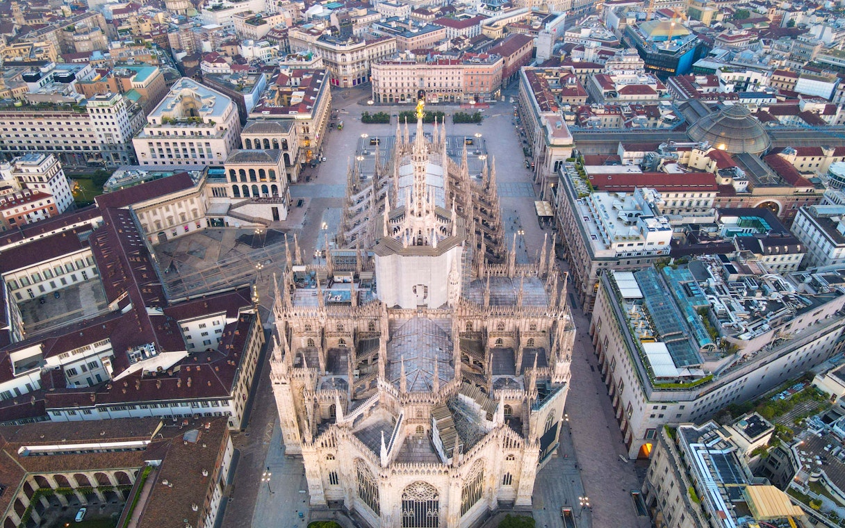 Aerial view of Duomo di Milano surrounded by cityscape.