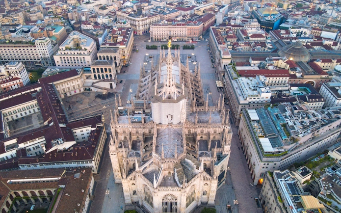 Aerial view of Duomo di Milano surrounded by cityscape.