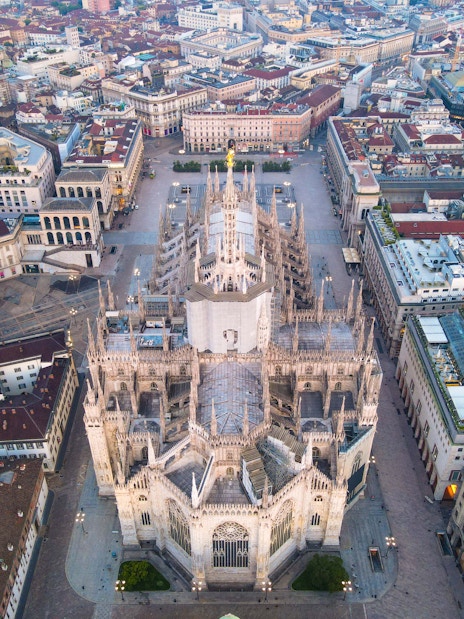 Aerial view of Duomo di Milano surrounded by cityscape.
