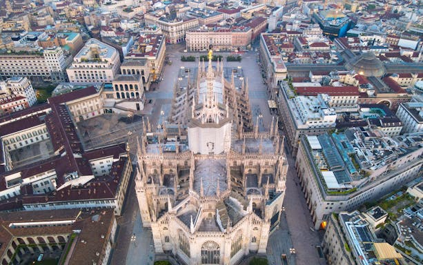 Aerial view of Duomo di Milano surrounded by cityscape.