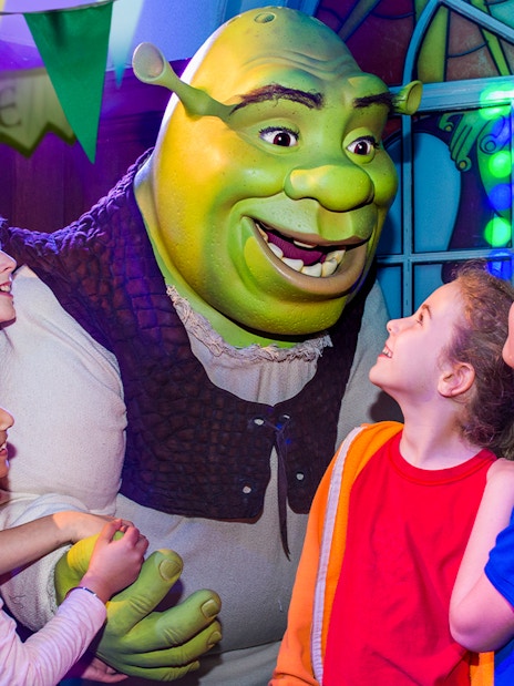 Children interacting with Shrek at Shrek’s Adventure! London.