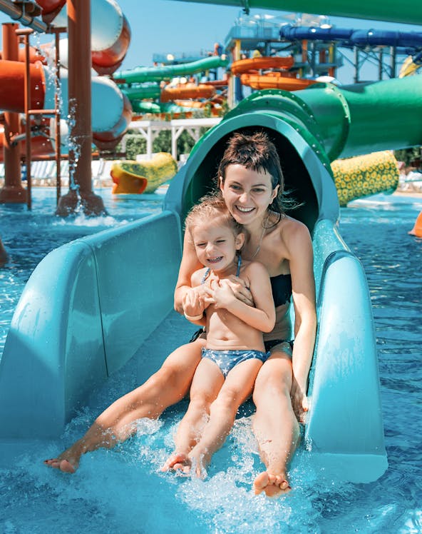 Mother and daughter on water slide at Adventure Cove Waterpark.