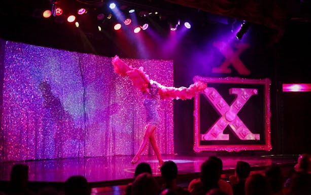 Performer on stage at X Burlesque - Kick'n Topless Revue, Vegas.