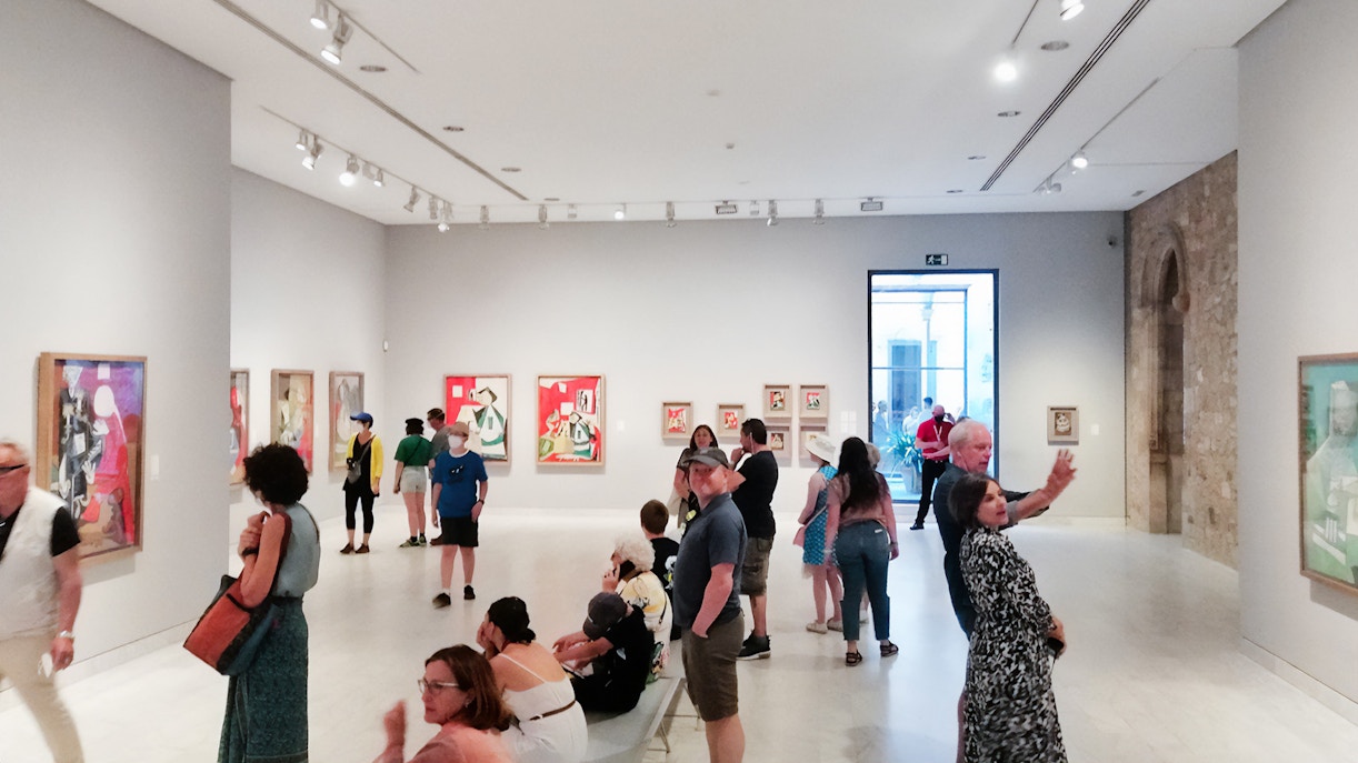 Visitors viewing Picasso paintings at the Picasso Museum in Barcelona.