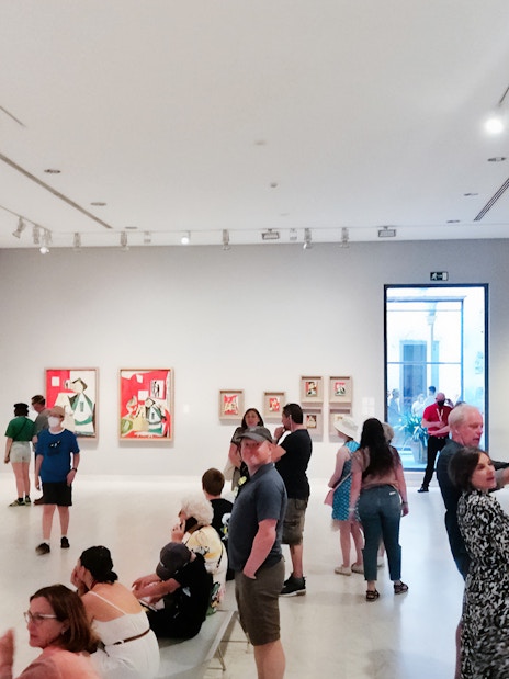 Visitors viewing Picasso paintings at the Picasso Museum in Barcelona.
