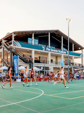 Players compete in a netball match at The Sevens Stadium, Dubai during Emirates Dubai 7s.