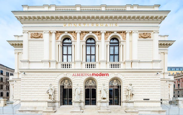 Albertina Modern entrance with classical statues, Vienna.