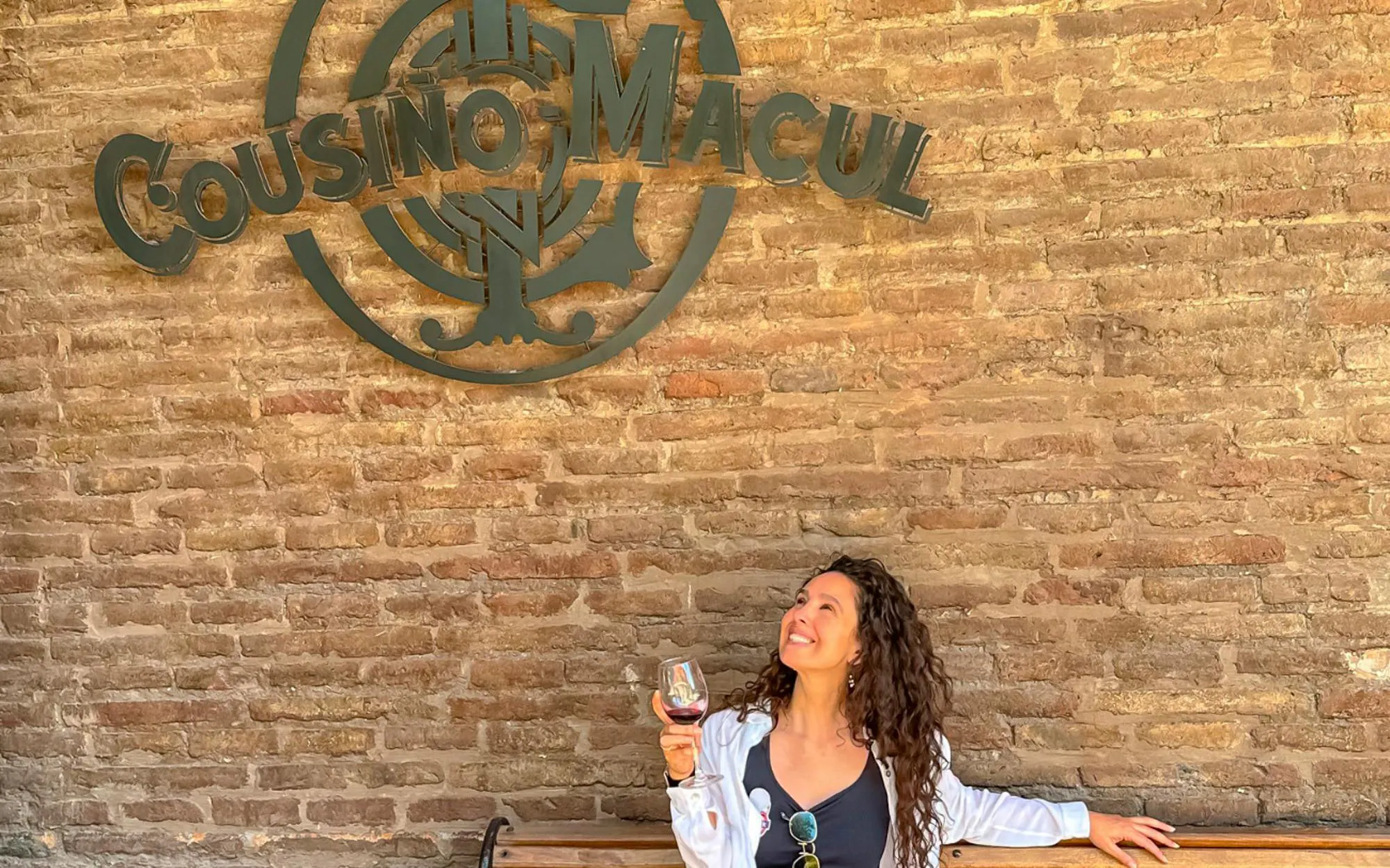 Tourist enjoying wine at Cousino Macul winery in Chile.