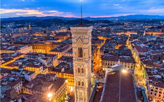 Florence skyline at dusk with Giotto's Campanile, part of the Haunted Florence tour.