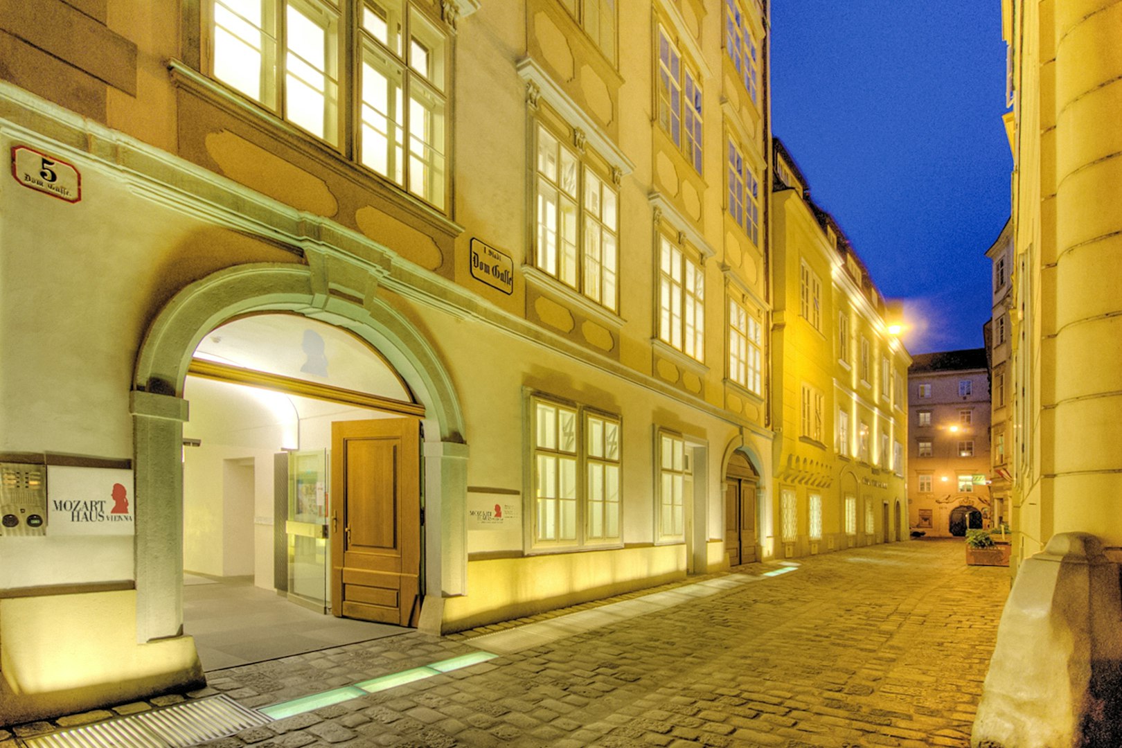 Mozarthaus Vienna entrance at night, venue for Wiener Ensemble concerts.