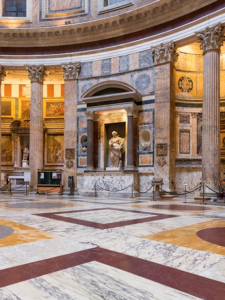 Pantheon interior in Rome with marble floors and ancient columns.