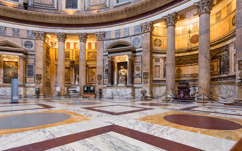 Pantheon interior in Rome with marble floors and ancient columns.
