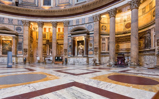 Pantheon interior in Rome with marble floors and ancient columns.