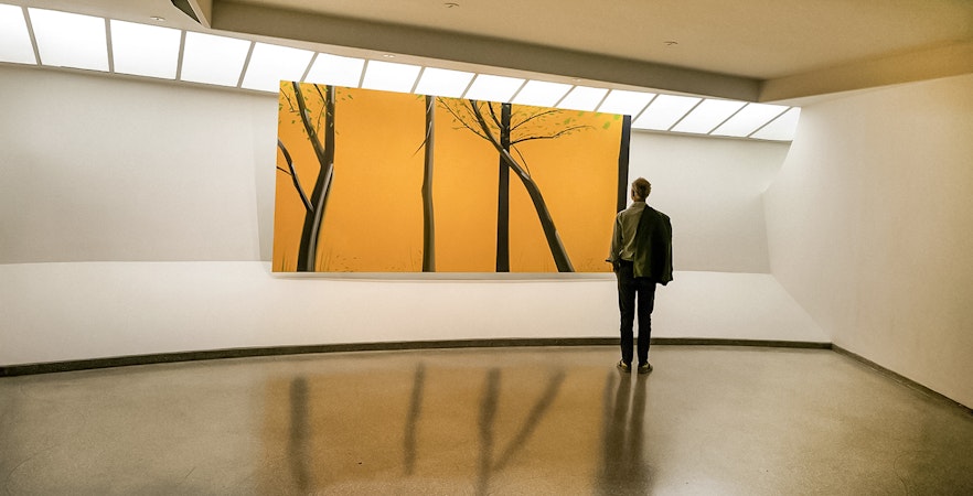 Visitor viewing modern art at Guggenheim Museum, New York.