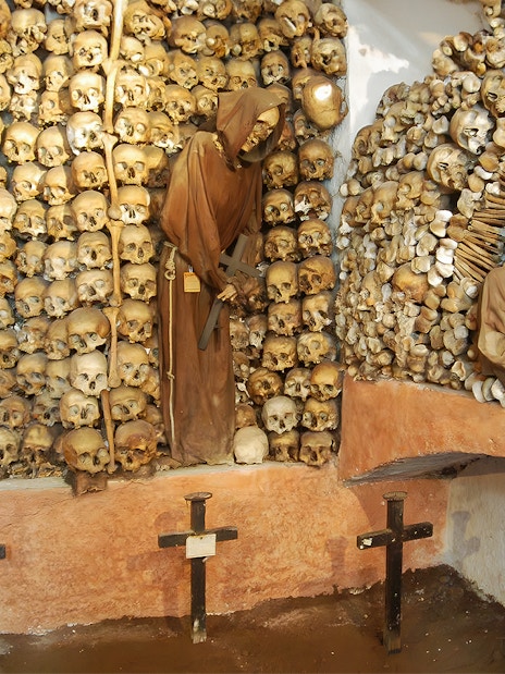 Skulls and monk figures in the Capuchin Crypt, Rome catacombs.