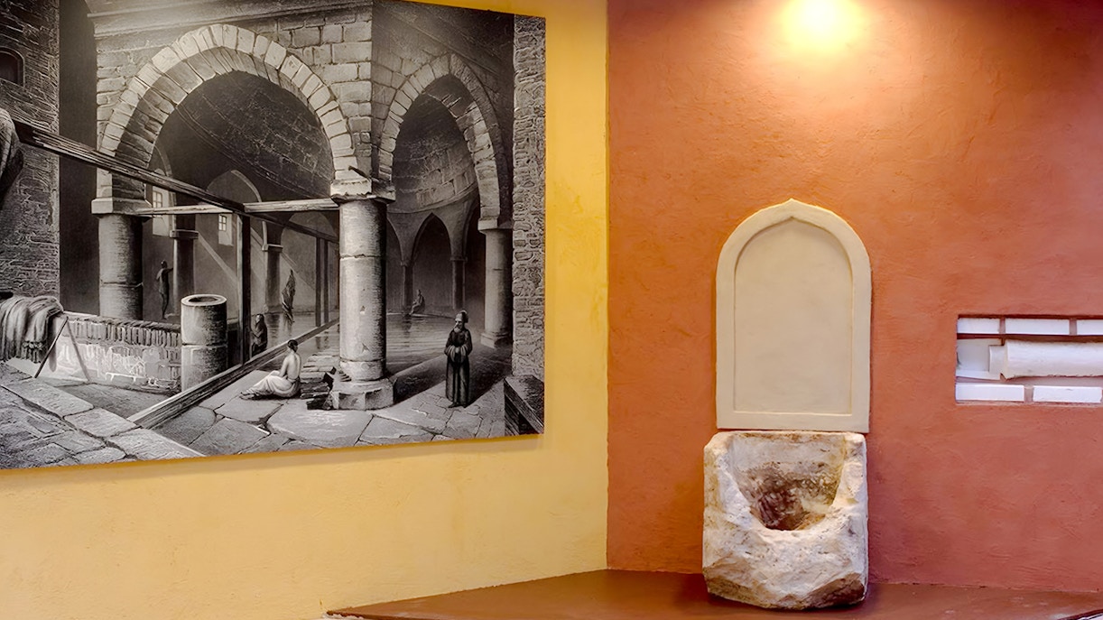 Rudas Thermal Spa interior with historic domed ceiling and warm bathing pool, Budapest, Hungary.