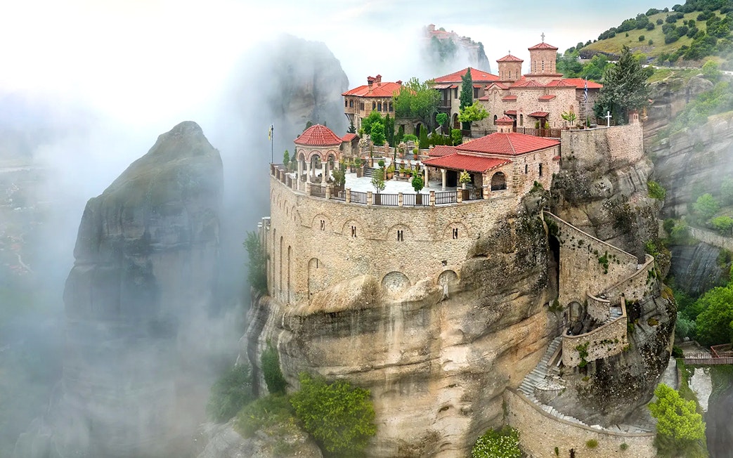Varlaam Monastery perched on a misty cliff in Meteora, Greece.