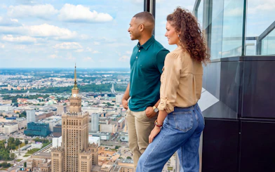 Couple enjoying city view from Highline Warsaw observation deck.