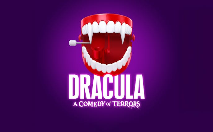 Wind-up vampire teeth with "Dracula: A Comedy of Terrors" text on purple background.