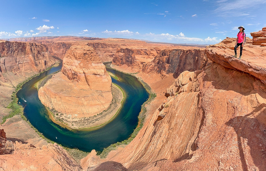 tourist exploring Horseshoe Bend on a day tour from Las Vegas