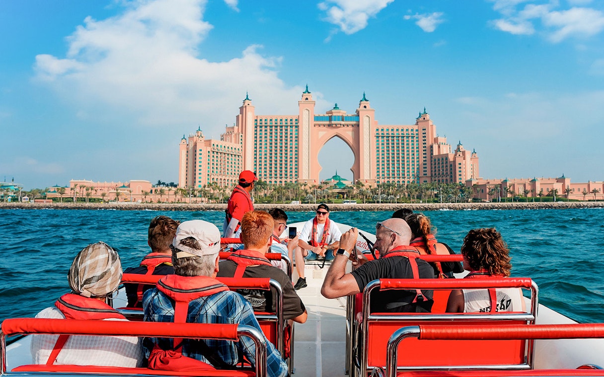 Speedboat tour group approaching Atlantis, The Palm in Dubai Marina.