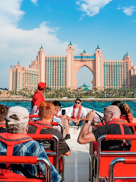 Speedboat tour group approaching Atlantis, The Palm in Dubai Marina.