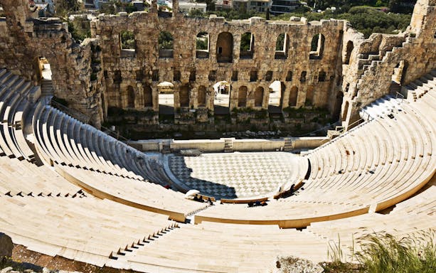 Ancient amphitheater at the Acropolis, Athens, viewed from above during a guided tour.