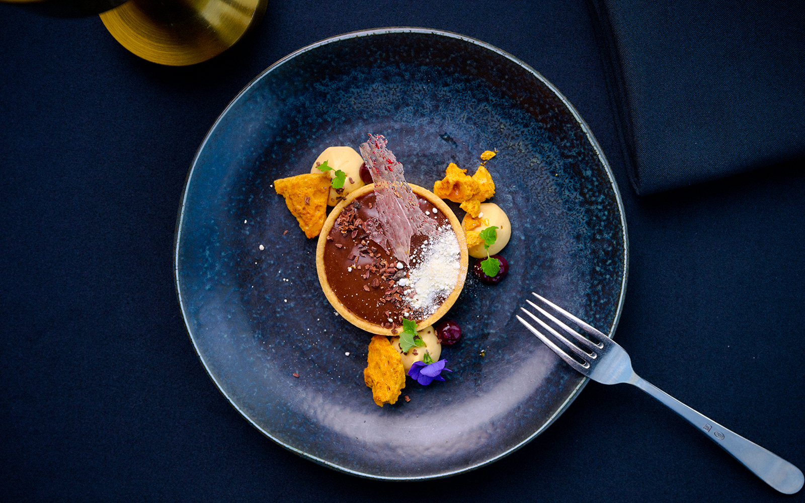 Chocolate tart with garnishes at Altitude dining, Melbourne Skydeck.