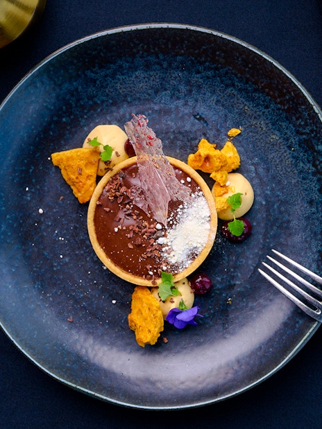 Chocolate tart with garnishes at Altitude dining, Melbourne Skydeck.
