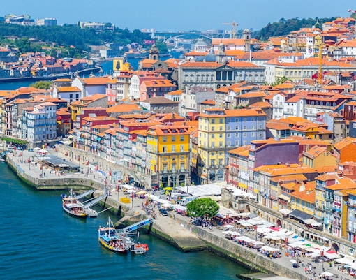 Colorful Ribeira district along Douro River in Porto, Portugal, near Fado show venues.