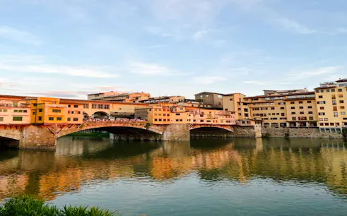 Ponte Vecchio over the Arno River at sunset, Florence Renaissance Highlights tour.