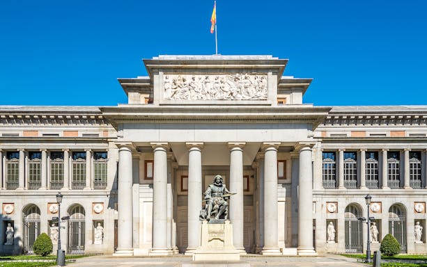 Prado Museum entrance with Velázquez statue in Madrid, Spain.