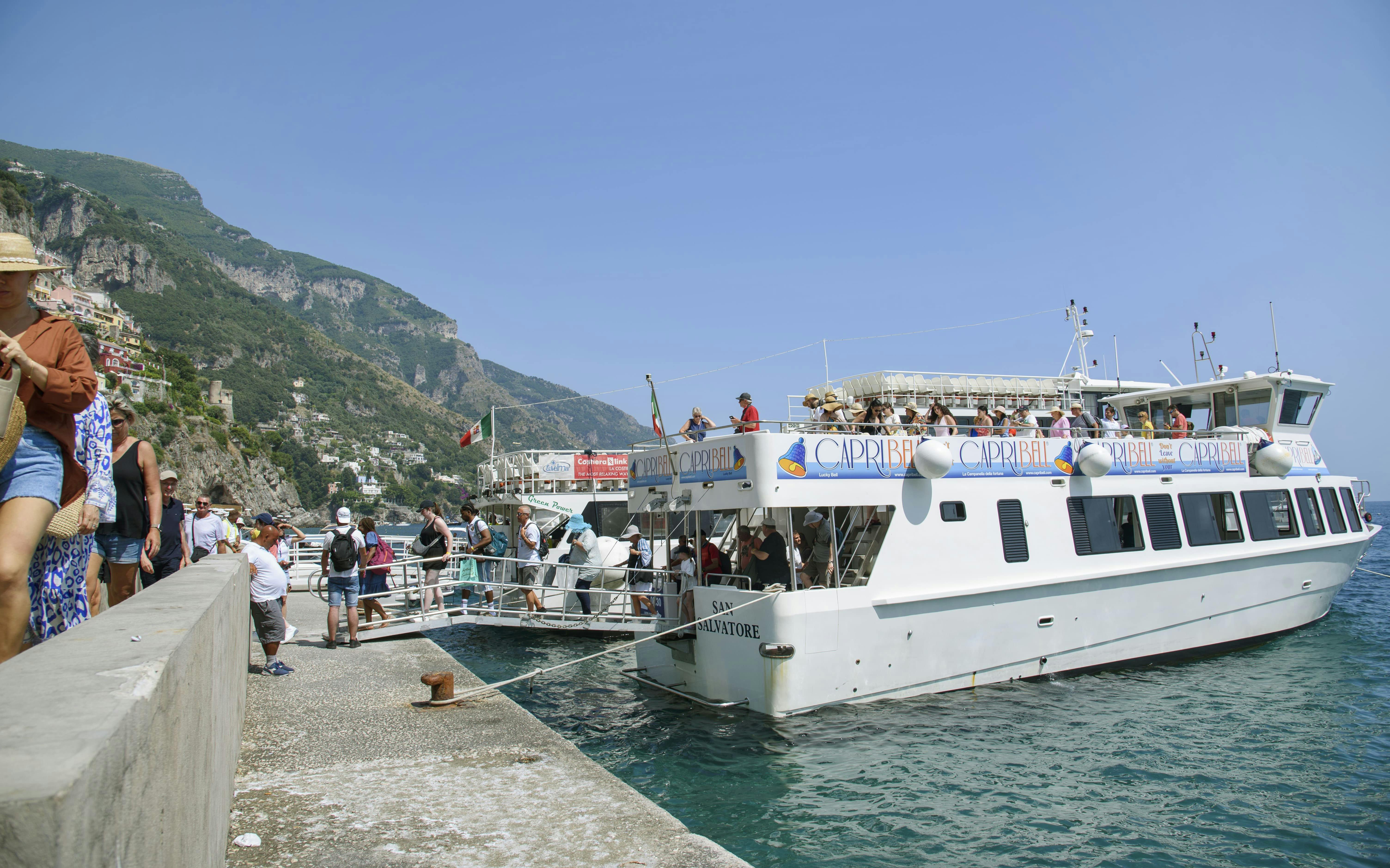 Tourists boarding a boat for an Amalfi Coast and Ravello tour from Sorrento.