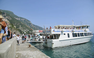 Tourists boarding a boat for an Amalfi Coast and Ravello tour from Sorrento.