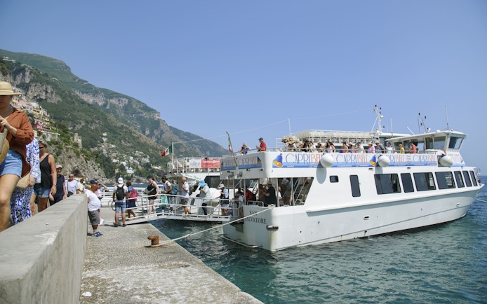 Tourists boarding a boat for an Amalfi Coast and Ravello tour from Sorrento.