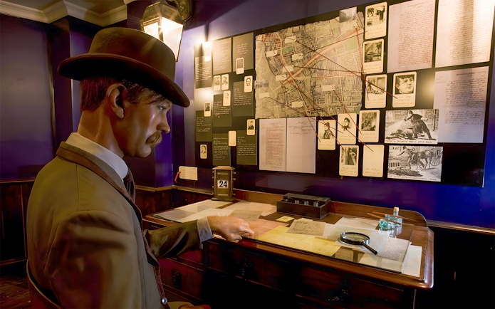 Detective mannequin examining Jack the Ripper case files at the Jack the Ripper Museum, London.