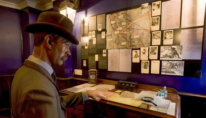 Detective mannequin examining Jack the Ripper case files at the Jack the Ripper Museum, London.