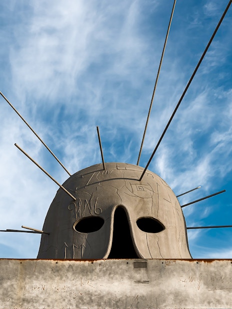 Sculpture with rods at Castel Sant'Elmo exhibit against blue sky.