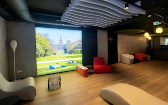 Lounge seating area at Alda Merini Classic Lounge, Malpensa Airport Terminal 2, Milan.