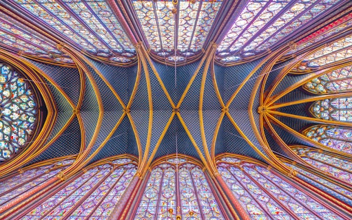 Sainte-Chapelle stained glass ceiling and arches during guided tour in Paris.