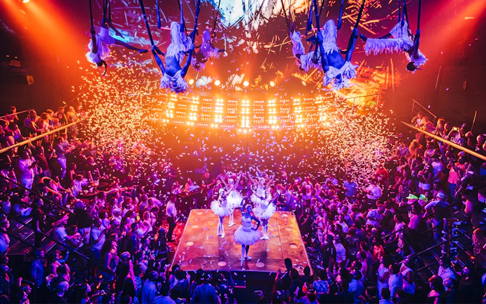 Aerial performers and dancers on stage at Coco Bongo Club, Punta Cana.
