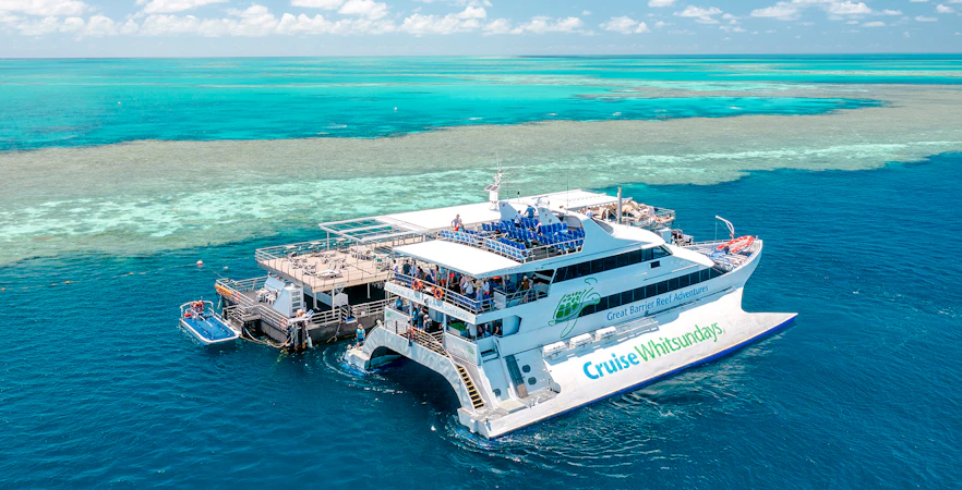 Cruise Whitsundays boat docked at pontoon, Great Barrier Reef.