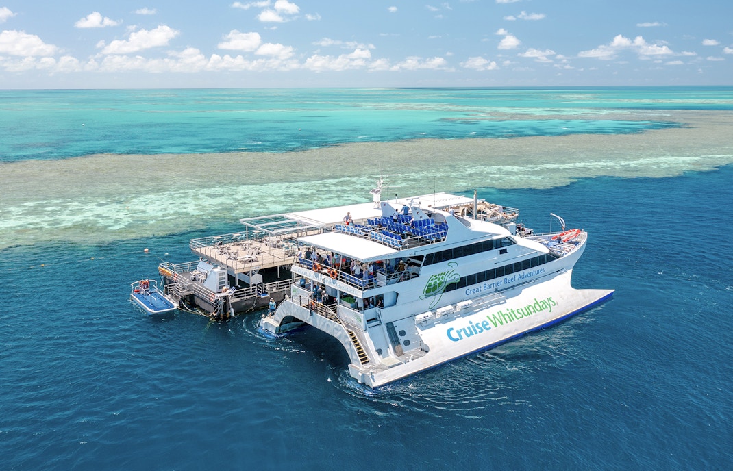 Cruise Whitsundays boat docked at pontoon, Great Barrier Reef.