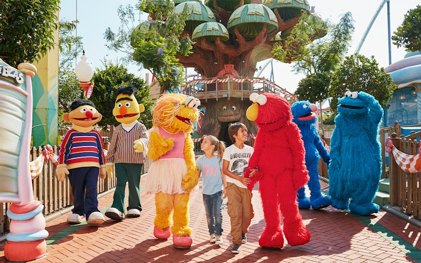 Children interacting with costumed characters at PortAventura World, Barcelona.