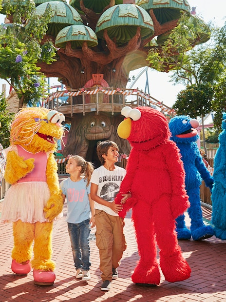Children interacting with costumed characters at PortAventura World, Barcelona.